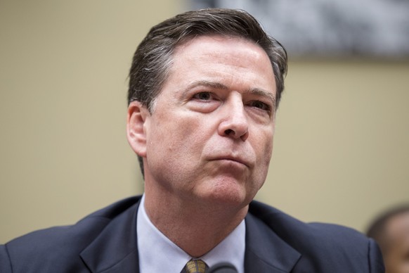 epa05610810 (FILE) A file photograph showing FBI Director James Comey testifying before the House Oversight and Government Reform Committee hearing on &#039;Oversight of the State Department&#039;, fo ...