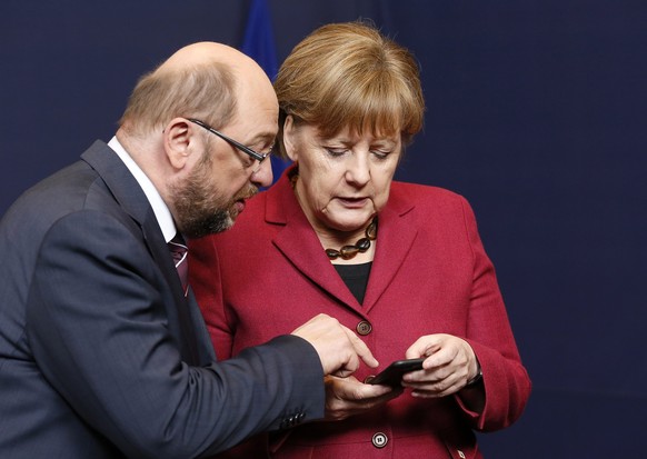epa05759361 (FILE) - A file picture dated 17 March 2016 shows then European Parliament President Martin Schulz (L) and German Federal Chancellor Angela Merkel talk on the first day of a two-day Europe ...