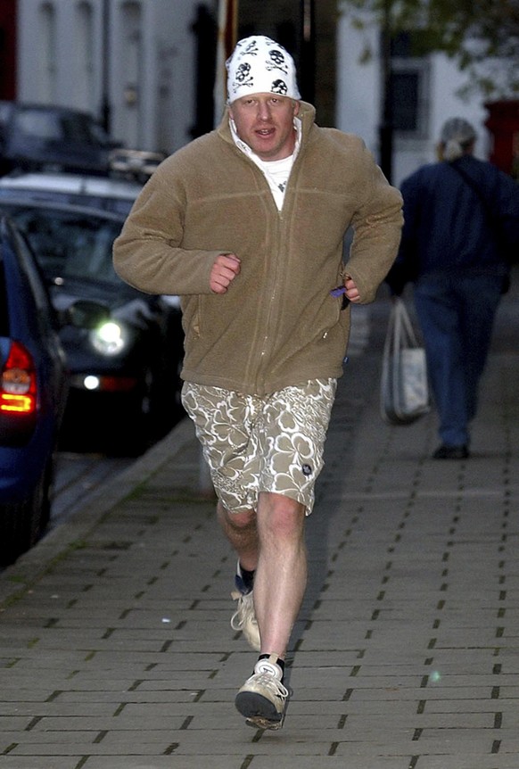 FILE - In this Nov. 15, 2004 file photo Boris Johnson comes back from a run just after he was sacked as the shadow arts minister of the Conservative party. Boris Johnson aspires to be a modern-day Win ...