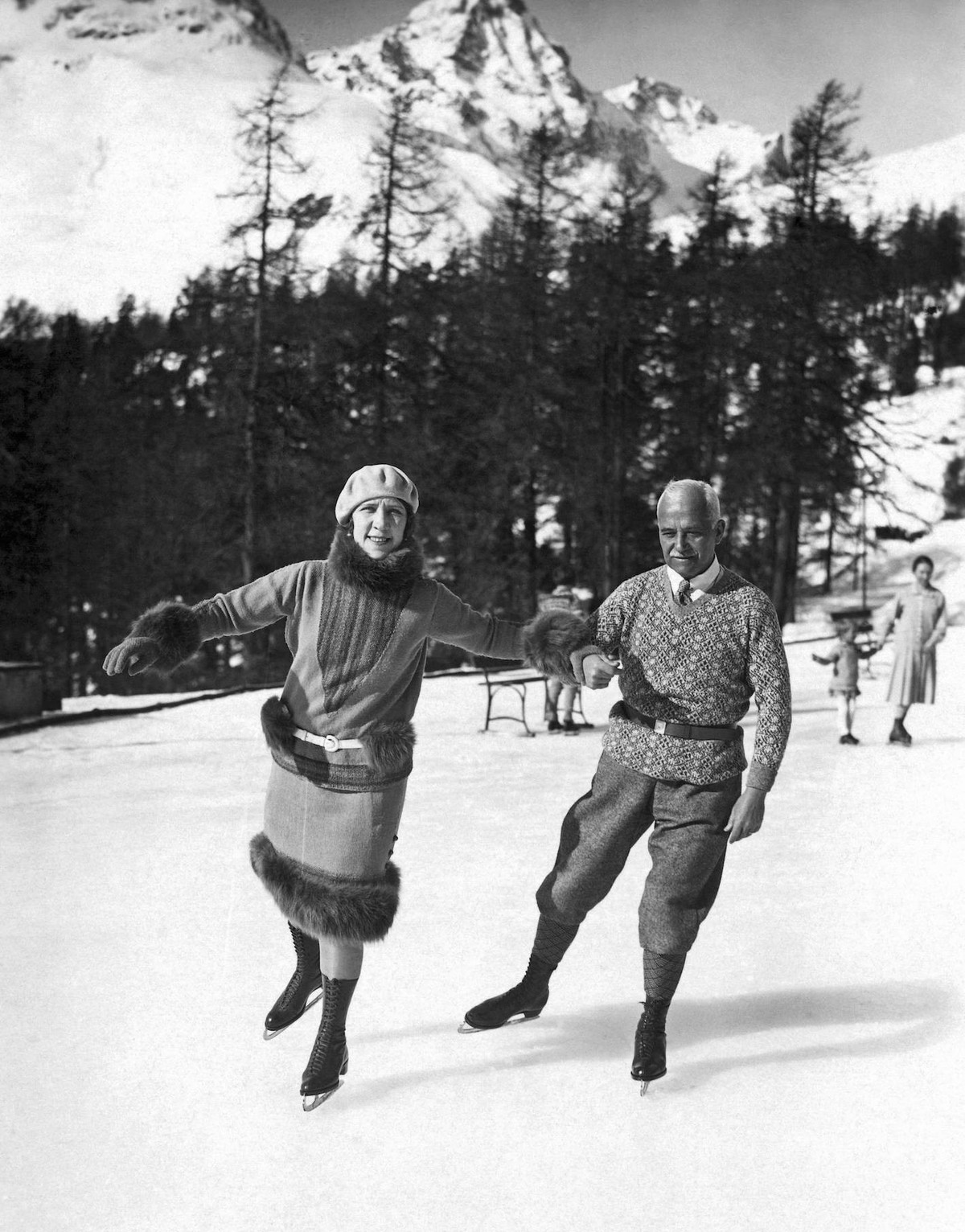 St. Moritz, Switzerland: c. 1933. Sir Henri Deterding and Lady Deterding skating on the winter rinks of Suvretta House in St. Moritz. He is the chairman of the Royal Dutch Petroleum Company. PUBLICATI ...