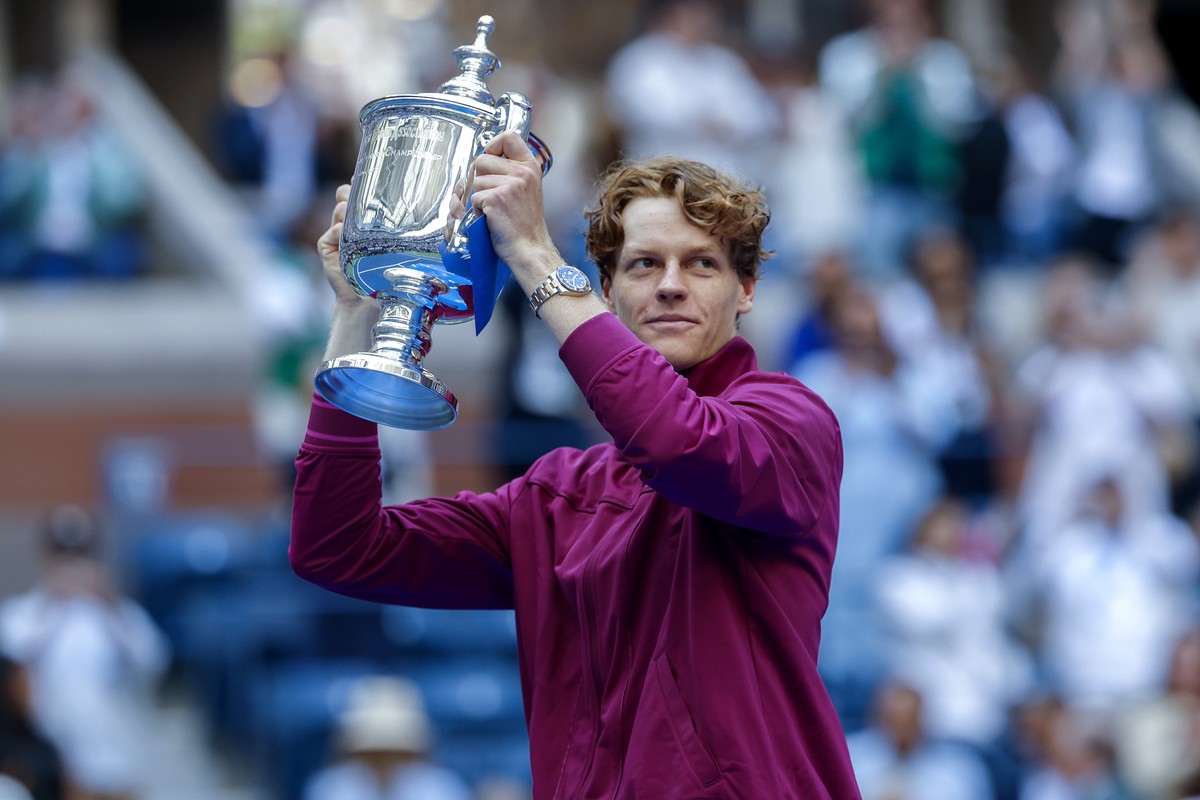 epa11593830 Jannik Sinner of Italy holds the U.S. Open Championship Trophy after his victory against Taylor Fritz of the United States during their men's final match of the US Open Tennis Champio ...