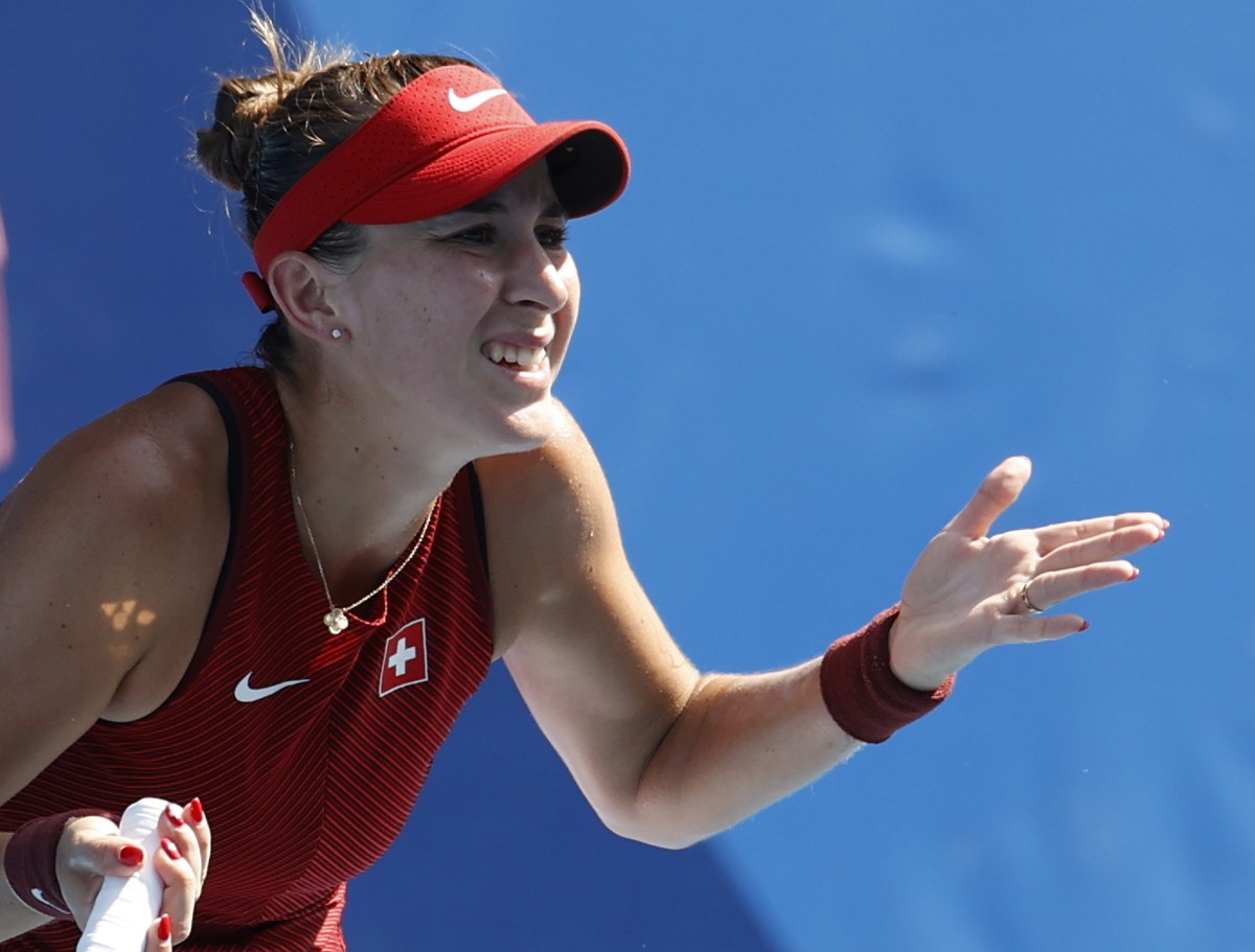 epa09372644 Belinda Bencic of Switzerland reacts during the women's singles quarterfinals match at the Tennis events of the Tokyo 2020 Olympic Games at the Ariake Coliseum in Tokyo, Japan, 28 Jul ...