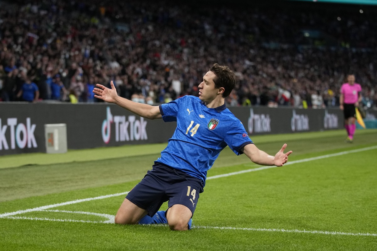 Italy's Federico Chiesa celebrates after scoring his side's opening goal during the Euro 2020 soccer semifinal match between Italy and Spain at Wembley stadium in London, Tuesday, July 6, 20 ...