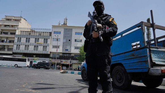 A member of Iran's Revolutionary Guard stands guard at Enqelab-e-Eslami (Islamic Revolution) square in downtown Tehran, Iran, Tuesday, June 24, 2025. (AP Photo/Vahid Salemi)
Iran Israel Mideast W ...