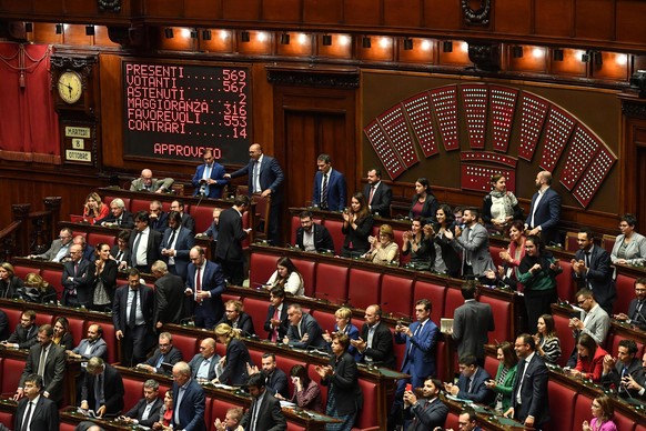 epa07905900 Members of the Chamber of the House applaud after voting to approve cutting the number of parliamentary seats, in Rome, Italy, 08 October 2019. The draft law will reduce the number of elec ...