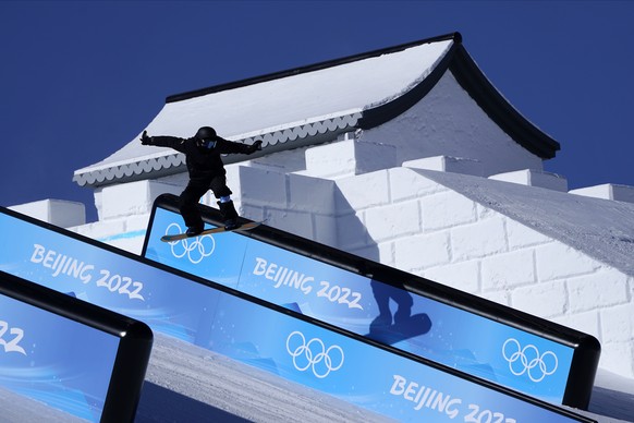 A snowboarder catches air on the slopestyle course ahead of ahead of the 2022 Winter Olympics, Wednesday, Feb. 2, 2022, in Zhangjiakou, China. (AP Photo/Gregory Bull)