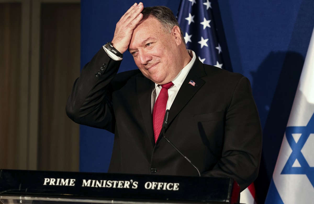 U.S. Secretary of State Mike Pompeo pats his head during a joint press conference with Israeli Prime Minister Benjamin Netanyahu and Bahrain's Foreign Minister Abdullatif bin Rashid Alzayani afte ...