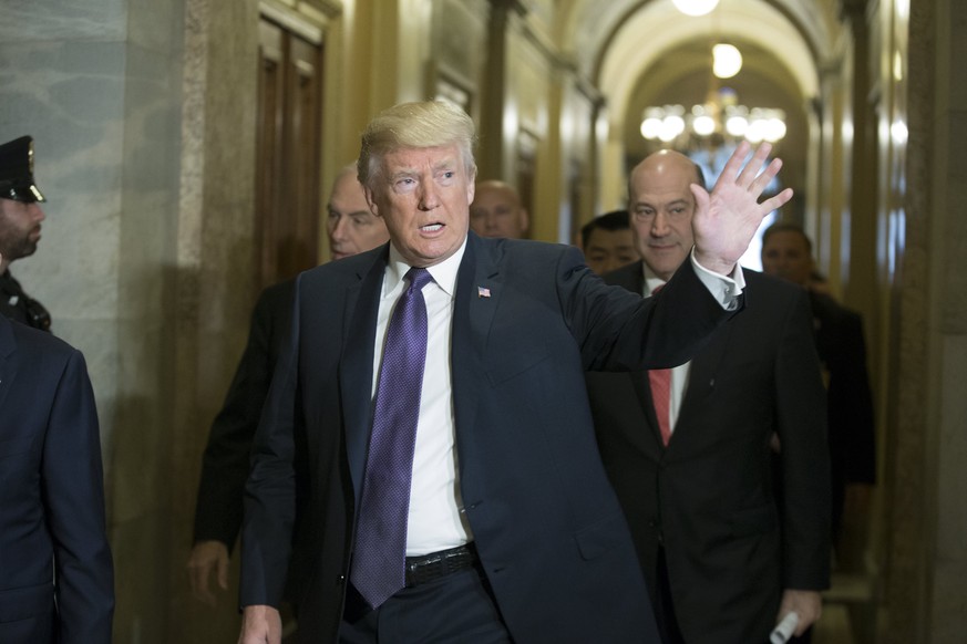 epa06333348 US President Donald J. Trump arrives to attend a House Republican caucus meeting in the US Capitol in Washington DC, USA, 16 November 2017. The House is voting today on their version of th ...