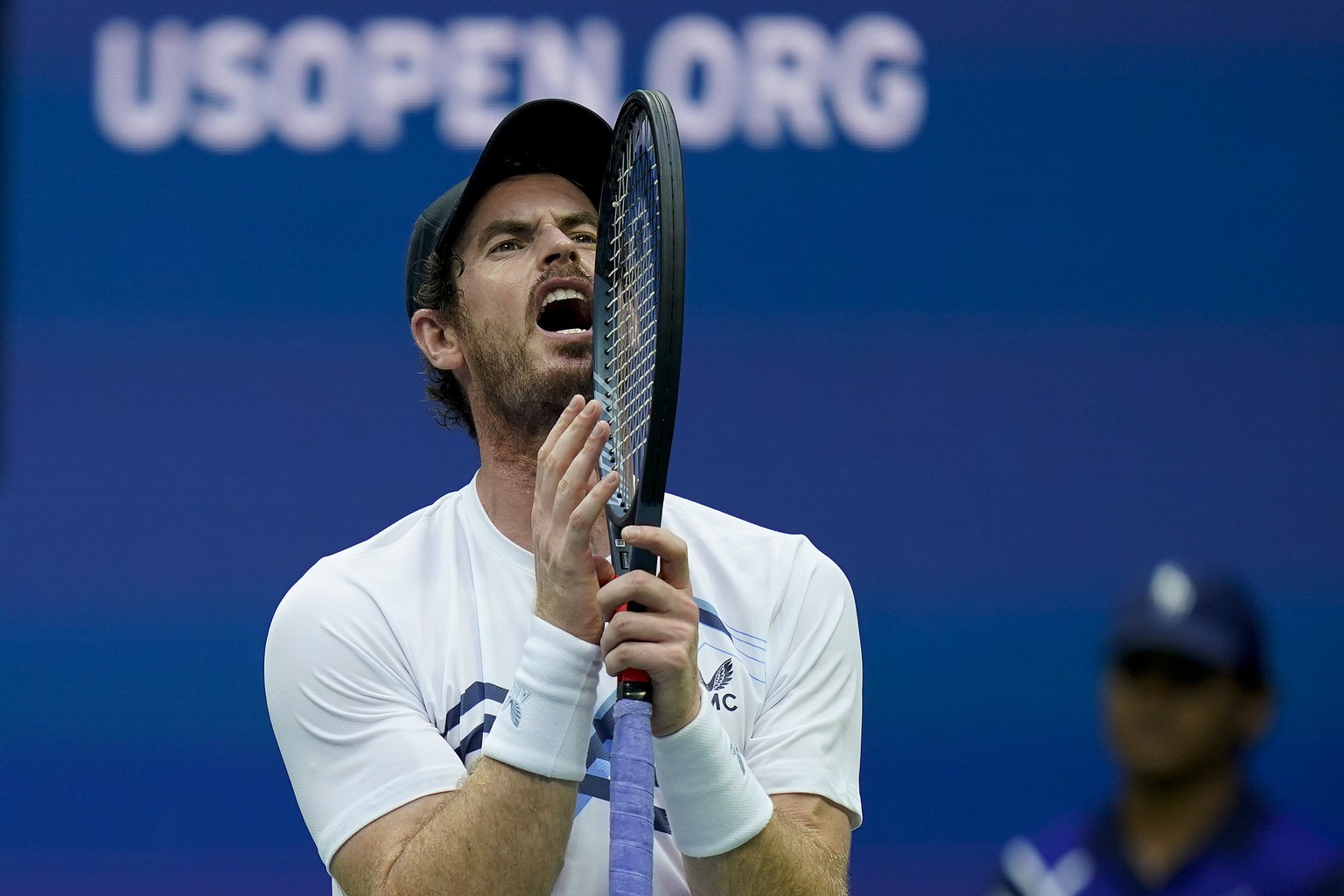 Andy Murray, of Great Britain, reacts after losing a point to Stefanos Tsitsipas, of Greece, during the first round of the US Open tennis championships, Monday, Aug. 30, 2021, in New York. (AP Photo/S ...