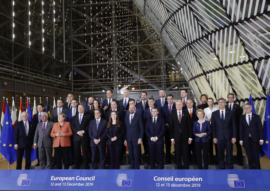 European Union leaders pose for a group photo during an EU summit in Brussels, Thursday, Dec. 12, 2019. European Union leaders gathered for their year-end summit and discussed climate change funding,  ...