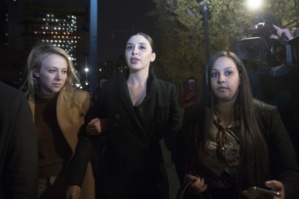 Emma Coronel, center, the wife of Joaquin &quot;El Chapo&quot; Guzman leaves Brooklyn Federal court after opening arguments in the trial of the Mexican drug lord known as &quot;El Chapo,&quot; Tuesday ...