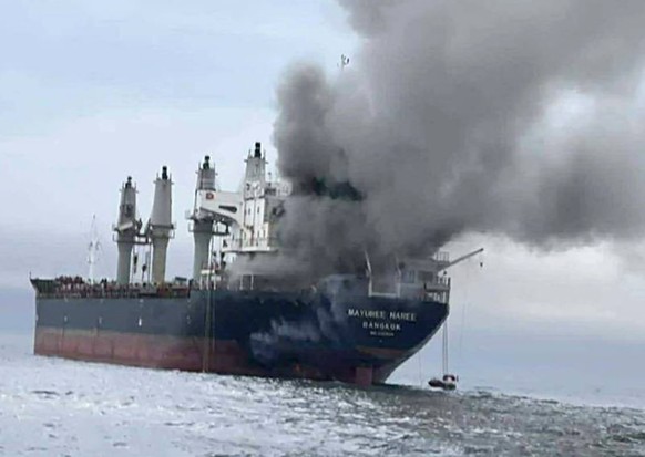 epa12813294 A handout photo made available by the Royal Thai Navy shows the Thai-flagged cargo ship Mayuree Naree on fire after being hit by Iranian missiles in the Strait of Hormuz, Iran, 11 March 20 ...