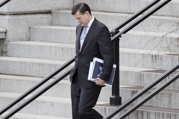 epa05715974 Trump transition team member Rob Porter walks outside the Eisenhower Executive Office Building following meetings, at the White House complex in Washington, DC, USA, 13 January 2017. Senio ...