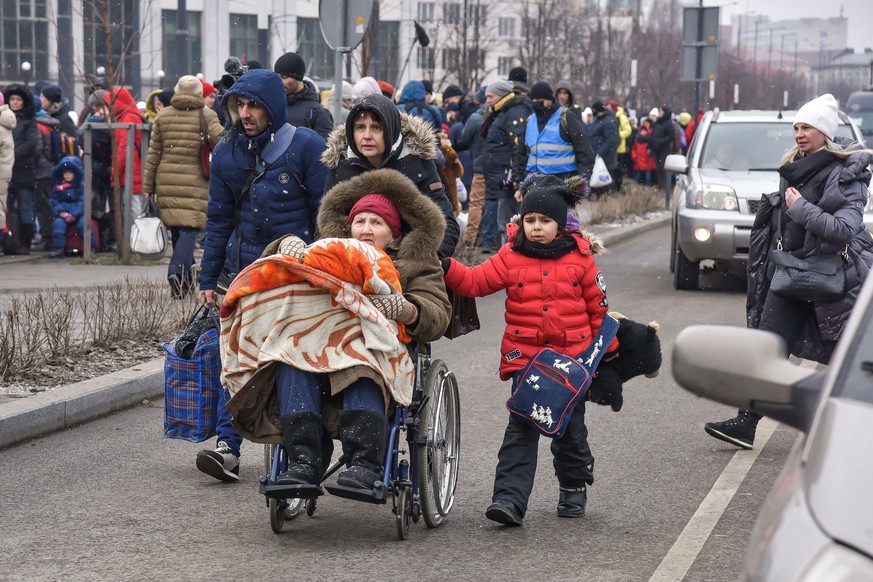 epa09808413 Ukrainian refugees at the train station in Lviv, western Ukraine, 07 March 2022. According to the United Nations (UN), at least 1.5 million people have fled Ukraine to neighboring countrie ...