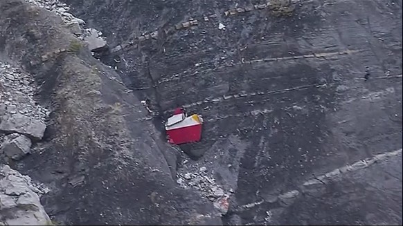 In this image made from TV, debris is scattered over the area after a Germanwings Airbus 320 crashed near Seyne-les-Alpes in the French Alps, Tuesday, March 24, 2015. A Germanwings passenger jet carry ...