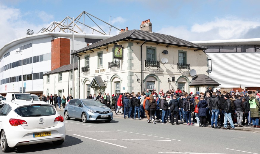 April 10, 2023, Bristol, England, United Kingdom: 10th April 2023 Racecourse Ground, Wrexham, Wales National League Football, Wrexham versus Notts County Crowds outside the famous Turf pub alongside t ...