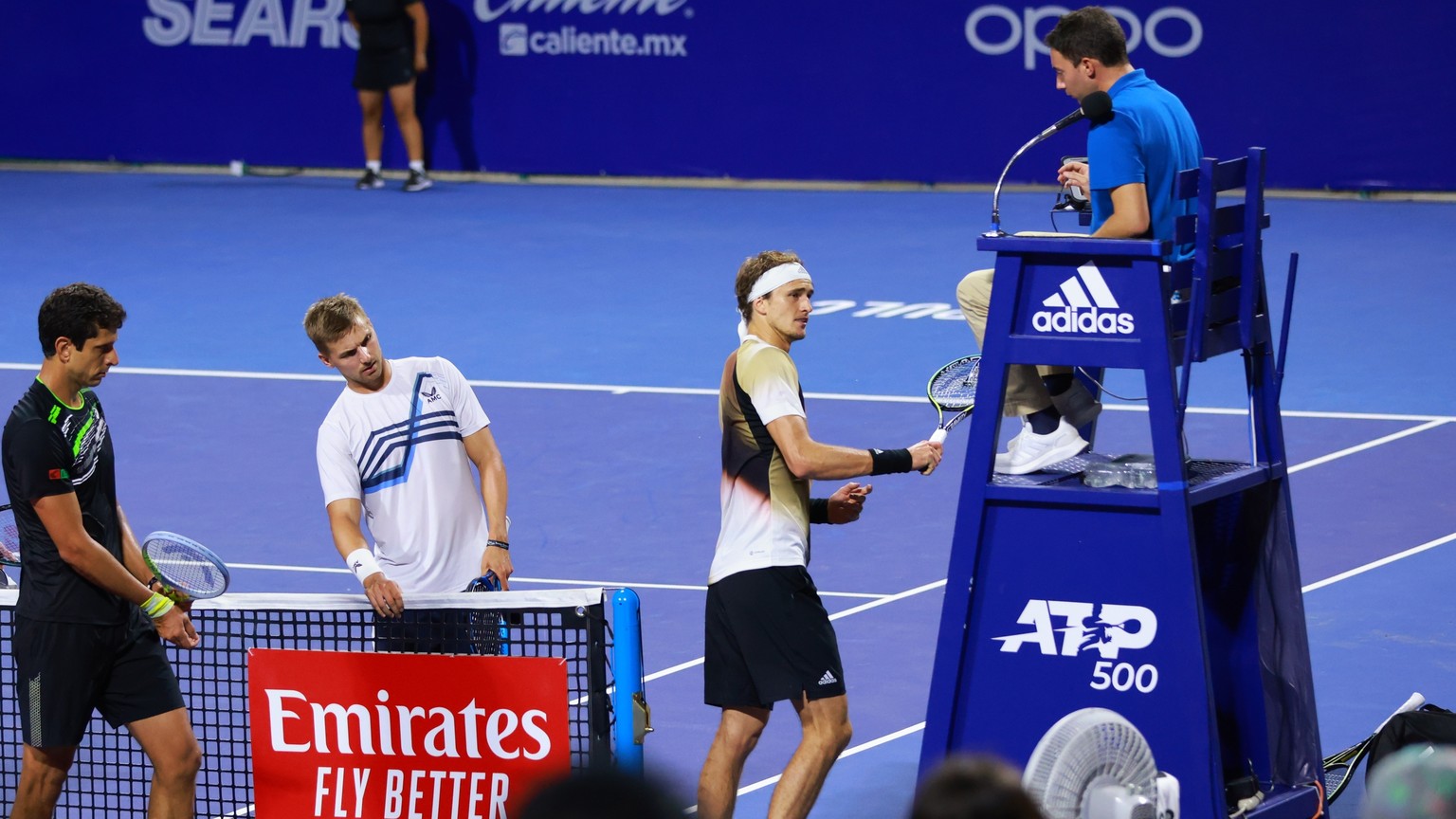 In this photo released by MexTenis, third-ranked Alexander Zverev of Germany smashes his racket on the umpire&#039;s chair moments after losing a doubles match of the Mexican Open tennis tournament in ...