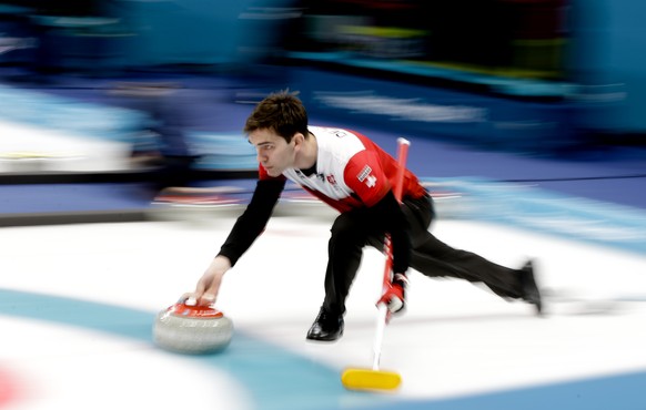 Switzerland's skip Peter de Cruz throws stone during a men's curling match against United States at the 2018 Winter Olympics in Gangneung, South Korea, Tuesday, Feb. 20, 2018. (AP Photo/Natacha Pisarenko)