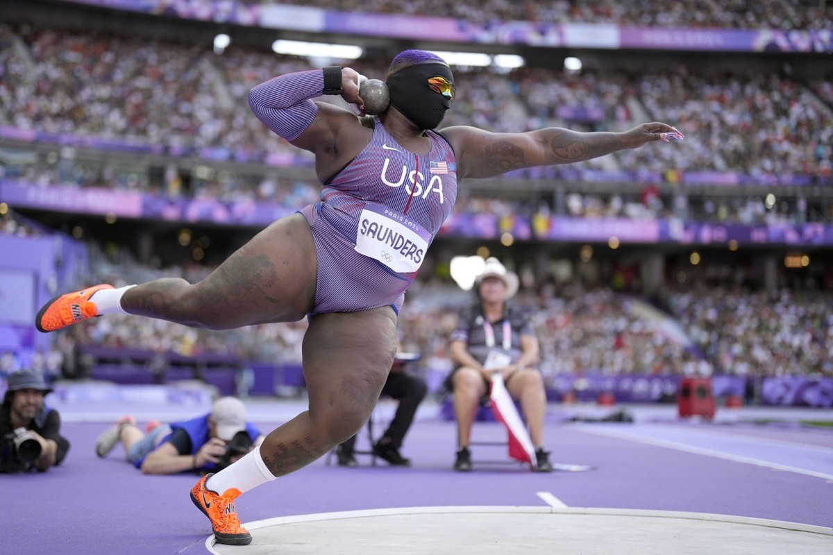 Raven Saunders, of the United States, competes during the women's shot put qualification at the 2024 Summer Olympics, Thursday, Aug. 8, 2024, in Saint-Denis, France. (AP Photo/Bernat Armangue)