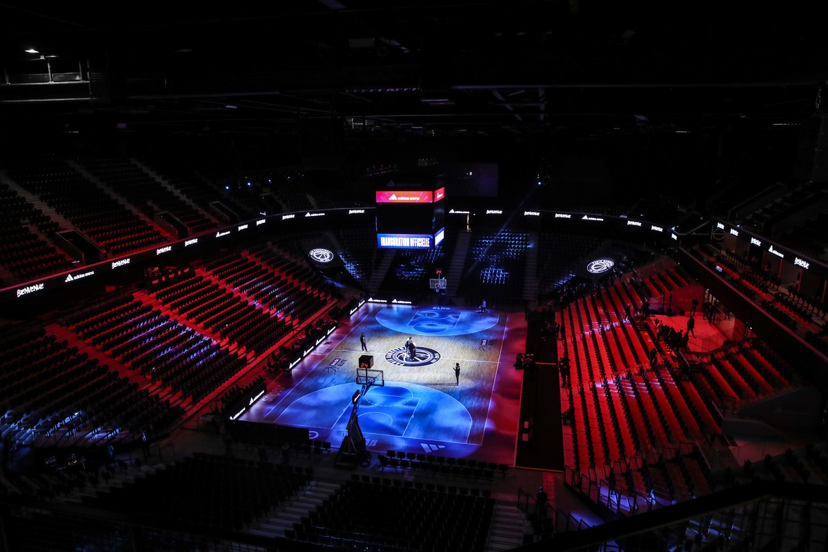 epa11145255 View of the illuminated center ring during a press visit for the inauguration of the Adidas Arena at Porte de la Chapelle, Paris, France, 11 February 2024. The Adidas Arena is the only fac ...