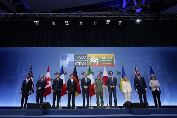 From left, Britain&#039;s Prime Minister Rishi Sunak, German Chancellor Olaf Scholz, French President Emmanuel Macron, Japan&#039;s Prime Minster Fumio Kishida, President Joe Biden, Ukrainian Presiden ...