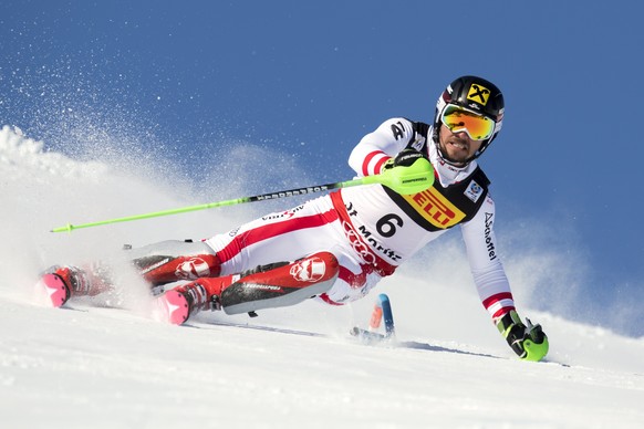 epa05803254 Marcel Hirscher, of Austria, clears a pole, during the first run of the men Slalom at the 2017 FIS Alpine Skiing World Championships in St. Moritz, Switzerland, 19 February 2017. EPA/GIAN  ...