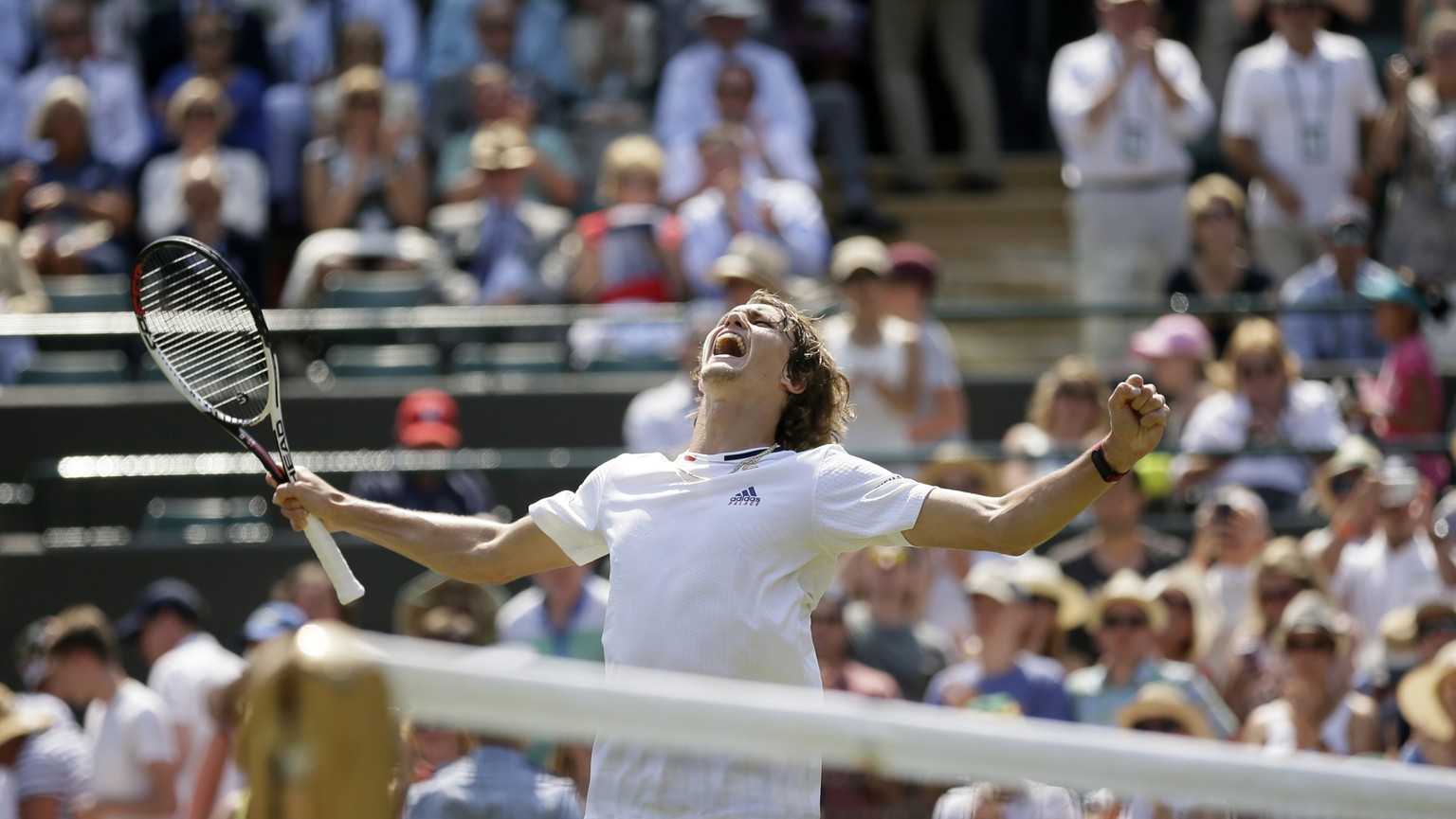 Alexander Zverev of Germany celebrates defeating Taylor Fritz of the US in their men&#039;s singles match on the fifth day at the Wimbledon Tennis Championships in London, Friday July 6, 2018. (AP Pho ...