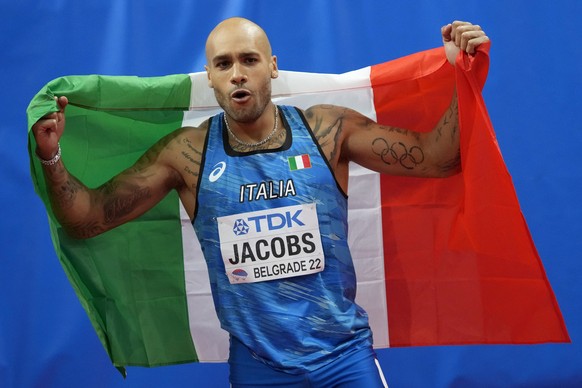 Lamont Marcell Jacobs, of Italy, celebrates after winning the Men's 60 meters final at the World Athletics Indoor Championships in Belgrade, Serbia, Saturday, March 19, 2022. (AP Photo/Darko Vojinovic)