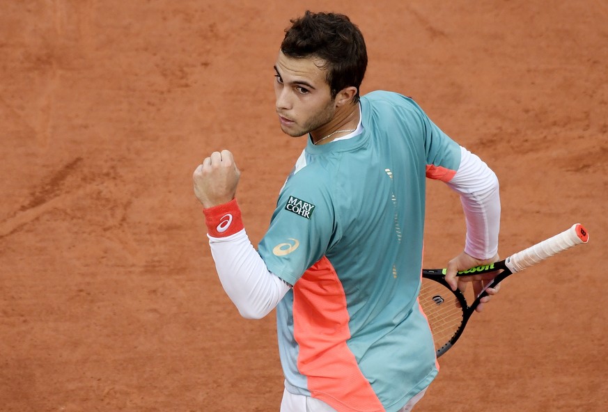 epa08715919 Hugo Gaston of France celebrates a point during his third round match against Stan Wawrinka of Switzerland at the French Open tennis tournament at Roland Garros in Paris, France, 02 Octobe ...