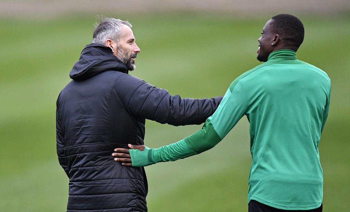 Moenchengladbach's head coach Marco Rose, left, cheers Denis Zakaria, right, during a training session prior the Champions League group B soccer match between Borussia Moenchengladbach and Real M ...
