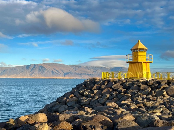 An amazing photo of the small Lighthouse in Reykjavik city Harbour xkwx sea panorama landscape sky travel water landmark ocean coast city architecture view nature building beach panoramic tourism coas ...