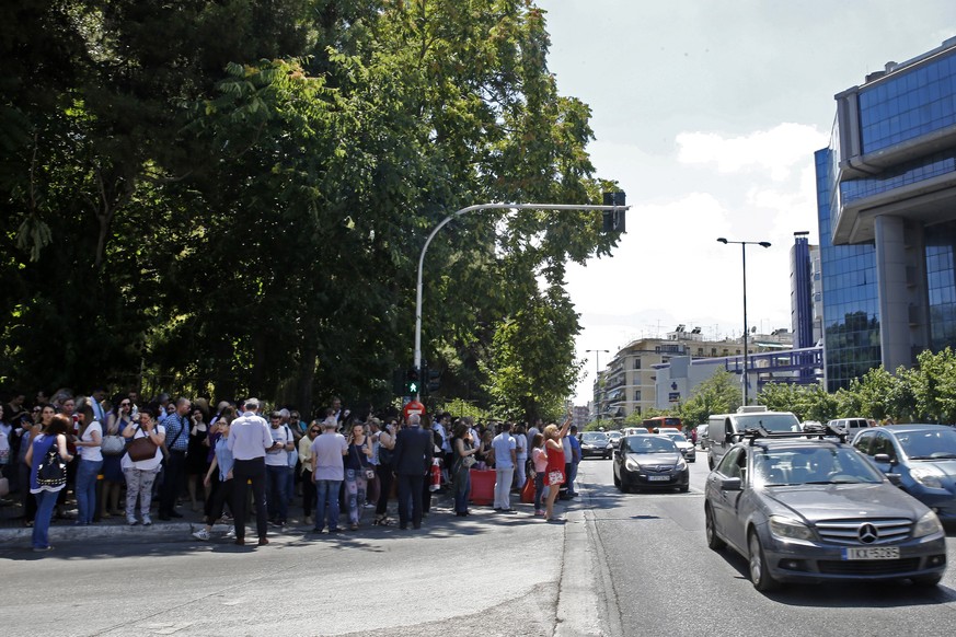 epa07726894 Citizens gather in an open area following an earthquake, in central Athens, Greece, 19 July 2019.An earthquake measuring 5.1 on the Richter scale shook Athens at 14:13 on 19 July 2019. The ...