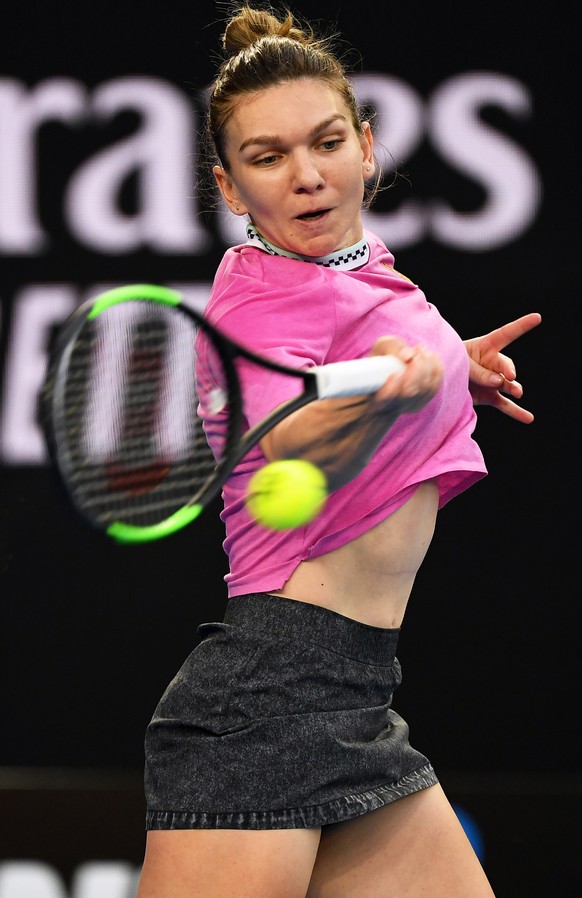 epa07285758 Simona Halep of Romania in action against Kaia Kanepi of Estonia during their women&#039;s first round match at the Australian Open tennis tournament in Melbourne, Australia, 15 January 20 ...