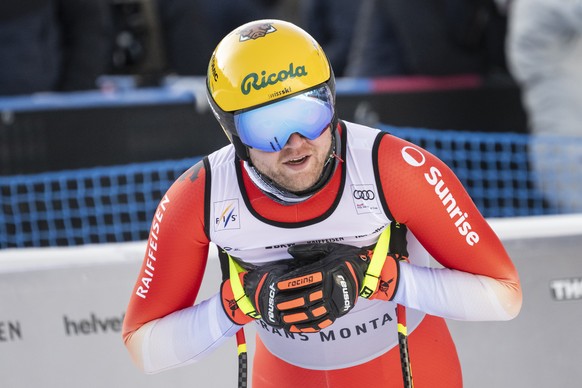 epa12694051 Niels Hintermann of Switzerland reacts in the finish area during a training session for the men's Downhill race at the Alpine Skiing FIS Ski World Cup, in Crans-Montana, Switzerland,  ...