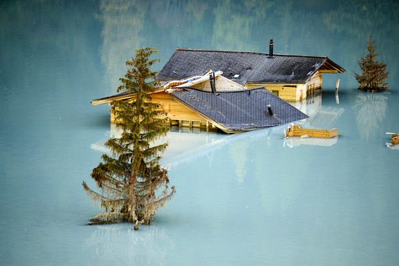 KEYPIX - Destroyed and flooded houses are pictured during the groundbreaking ceremony of reconstruction the village, project "Blatten 2030", 3,5 months after a landslide destroyed the villag ...