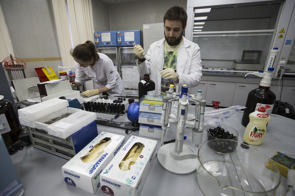 FILE - In this May 24, 2016 file photo, employees Natalya Bochkaryova, left, and Ilya Podolsky work at the Russia's national drug-testing laboratory in Moscow, Russia. Russia is accused of manipu ...