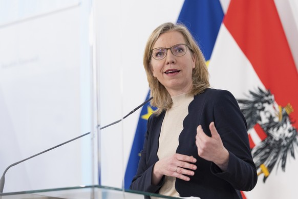 FILE - Austria&#039;s minister for climate protection, technology and innovation Leonore Gewessler speaks during a news conference behind plexiglass shields at the federal chancellery in Vienna, Austr ...
