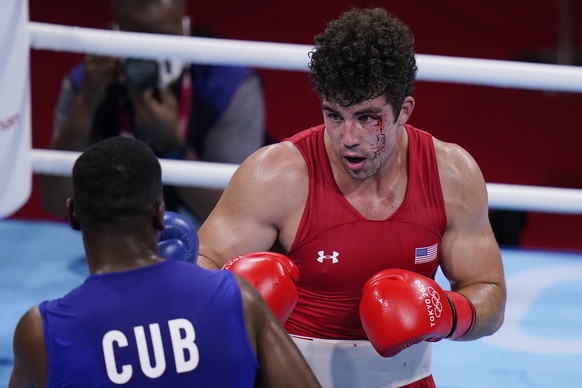 Richard Torrez Jr., from the United States, right, exchanges punches with Cuba&#039;s Dainier Pero during their men&#039;s super heavyweight over 91-kg boxing match at the 2020 Summer Olympics, Sunday ...