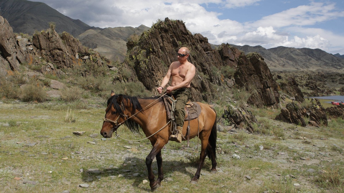 FILE - Then Russian Prime Minister Vladimir Putin rides a horse while traveling in the mountains of the Siberian Tyva region (also referred to as Tuva), Russia, Aug. 3, 2009. Putin has shot back at We ...