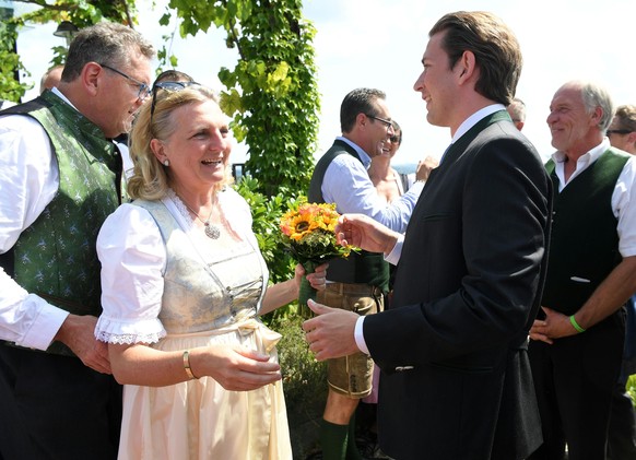 epa06956097 Austrian Foreign Minister Karin Kneissl (C) and Austrian Chancellor Sebastian Kurz (R) during her wedding to Austrian businessman Wolfgang Meilinger (R) in Gamlitz, Austria, 18 August 2018 ...