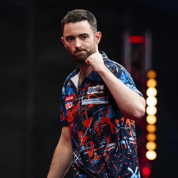 epa10866902 Luke Humphries reacts during his match against Michael van Gerwen in the semi-finals of the World Series Finals in Amsterdam, the Netherladns, 17 September 2023. EPA/FREEK VAN DEN BERGH