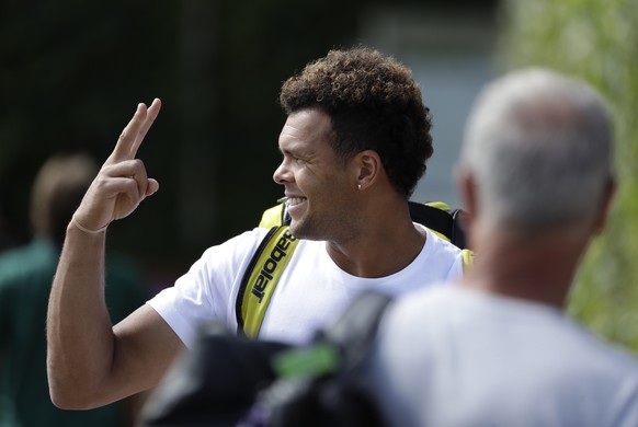 Jo-Wilfried Tsonga of France gestures as he arrives for a training session ahead of the Wimbledon Tennis Championships in London, Sunday, June 30, 2019. (AP Photo/Ben Curtis)