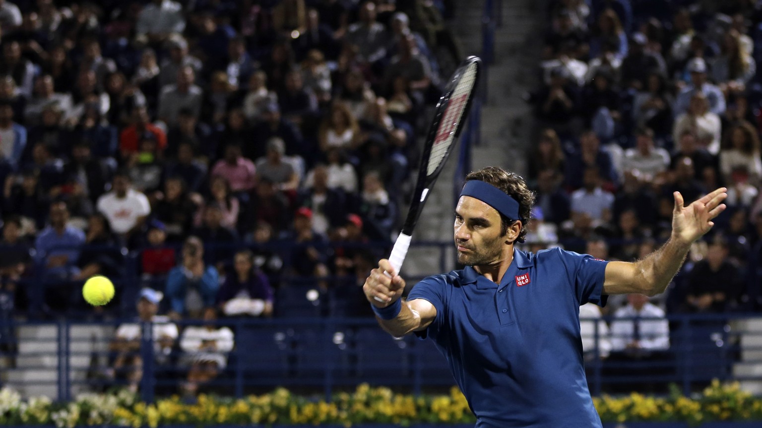 Roger Federer of Switzerland returns the ball to Marton Fucsovics of Hungry during their match at the Dubai Duty Free Tennis Championship, in Dubai, United Arab Emirates, Thursday, Feb. 28, 2019. (AP  ...