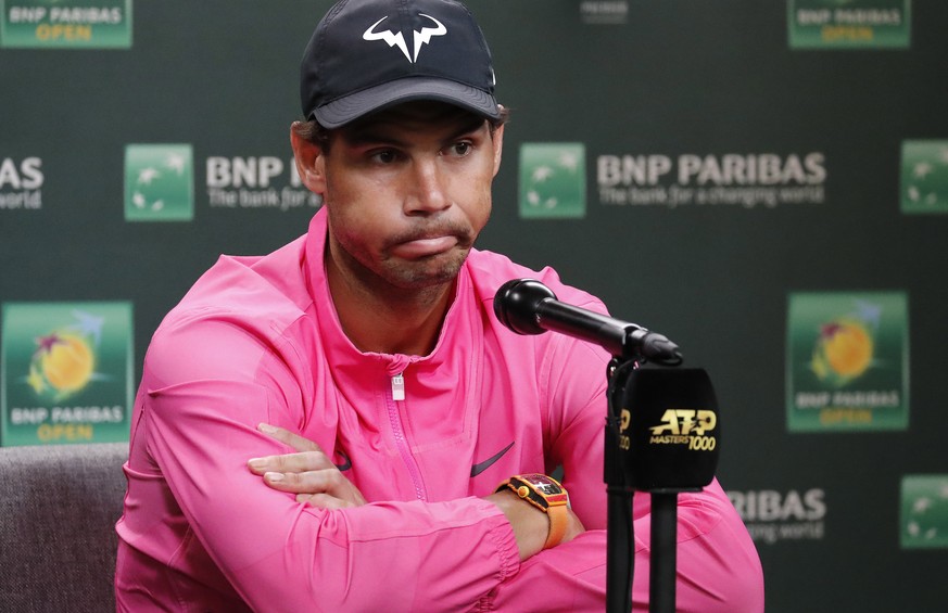 epa07443249 Rafael Nadal of Spain reacts to questions after announcing his withdrawal from his semifinal match against Roger Federer of Switzerland due to injury during the BNP Paribas Open tennis tou ...
