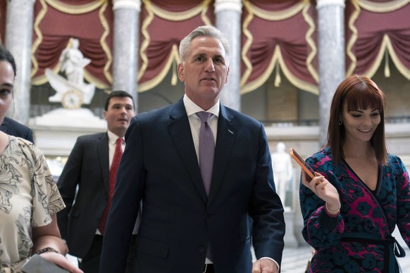 epa10580992 House Speaker Kevin McCarthy (center) walks into the U.S. Capitol in Washington DC, U.S., April 19, 2023. The House Republicans have introduced a bill called the Limit, Save, Grow Act in which R...
