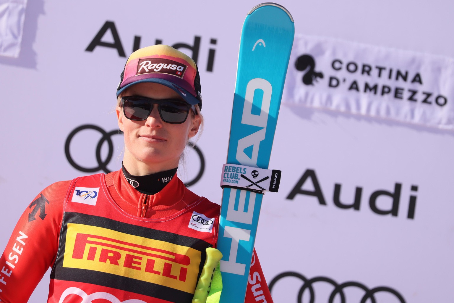 epa11110420 Winner Lara Gut-Behrami of Switzerland celebrates on the podium after the Women&#039;s SuperG race at the FIS Alpine Skiing World Cup in Cortina d&#039;Ampezzo, Italy, 28 January 2024. EPA ...