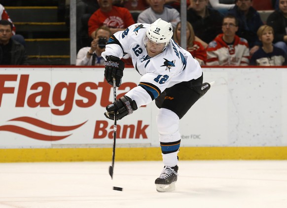 San Jose Sharks&#039; Patrick Marleau shoots against the Detroit Red Wings during the third period of an NHL hockey game in Detroit on Thursday, March 26, 2015. Marleau scored on the shot. (AP Photo/P ...