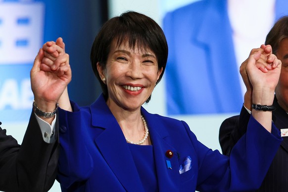 FILE - Newly-elected leader of Japan&#039;s Liberal Democratic Party (LDP) Sanae Takaichi celebrates after winning the LDP leadership election in Tokyo, Japan, Oct. 4, 2025. (Kim Kyung-Hoon/Pool Photo ...