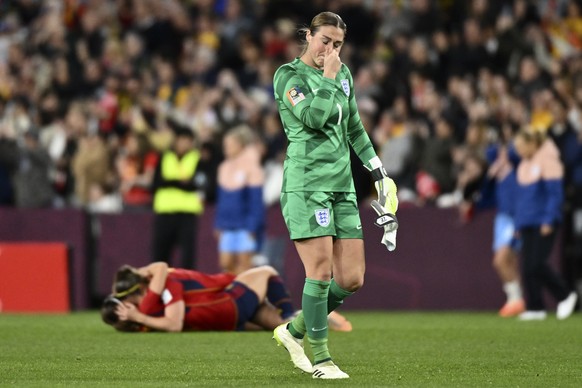 Spain&#039;s players celebrate as England&#039;s goalkeeper Mary Earps reacts after the Women&#039;s World Cup soccer final between Spain and England at Stadium Australia in Sydney, Australia, Sunday, ...