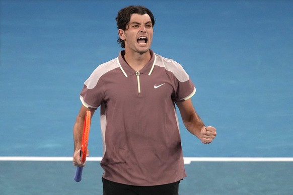 Taylor Fritz of the U.S. celebrates after defeating Facundo Diaz Acosta of Argentina in their first round match at the Australian Open tennis championships at Melbourne Park, Melbourne, Australia, Sun ...